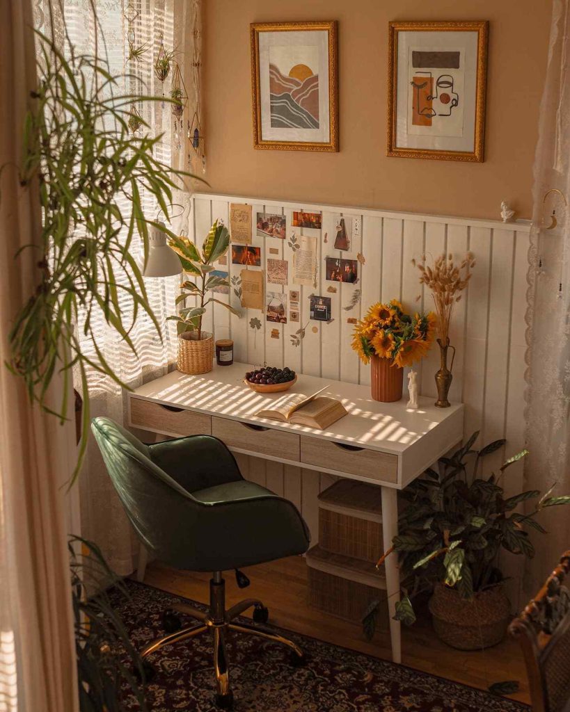 Warm desk with sunflowers and layered inspiration wall.