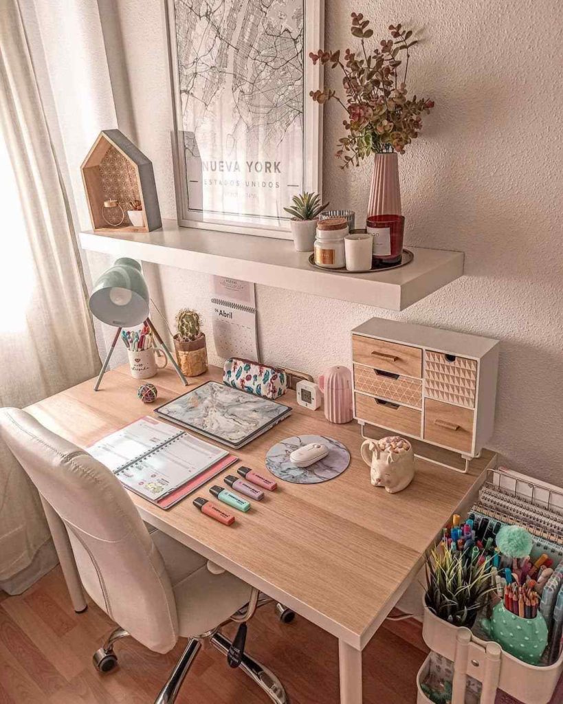 Organized pastel desk with highlighters and storage.