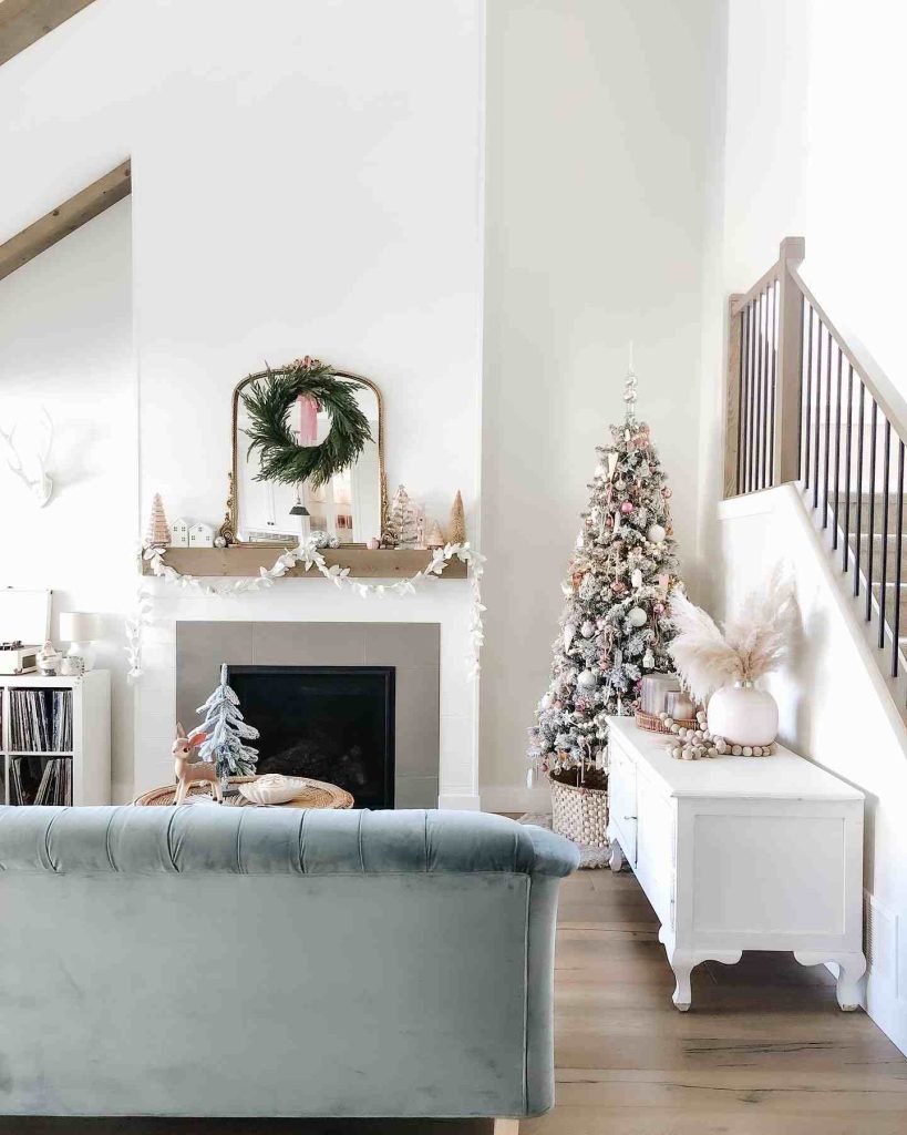 Frosted tree with blush ornaments and pampas grass.
