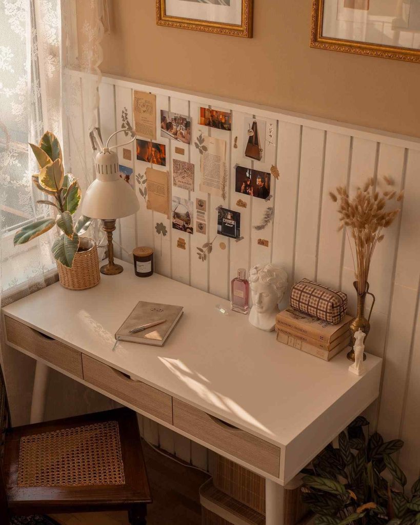 Elegant desk with soft lighting and artistic decor.