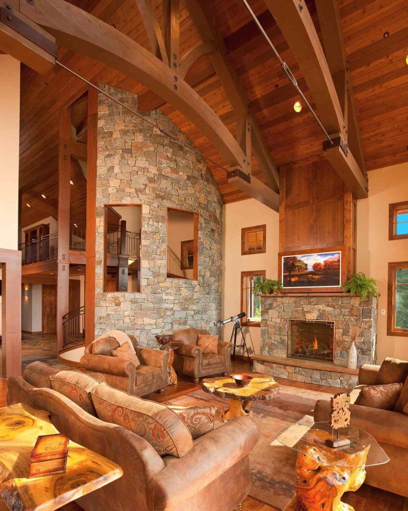 Grand rustic living room with stone wall and wood beams