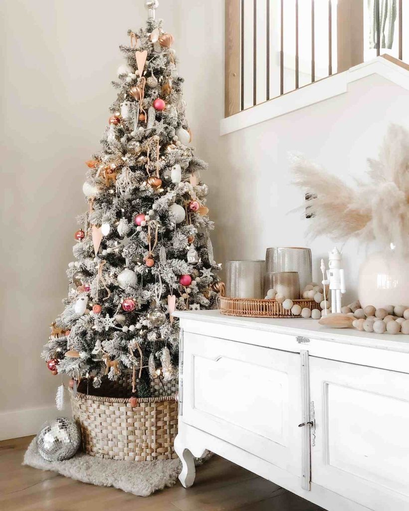 Frosted tree with gold accents and pampas grass.
