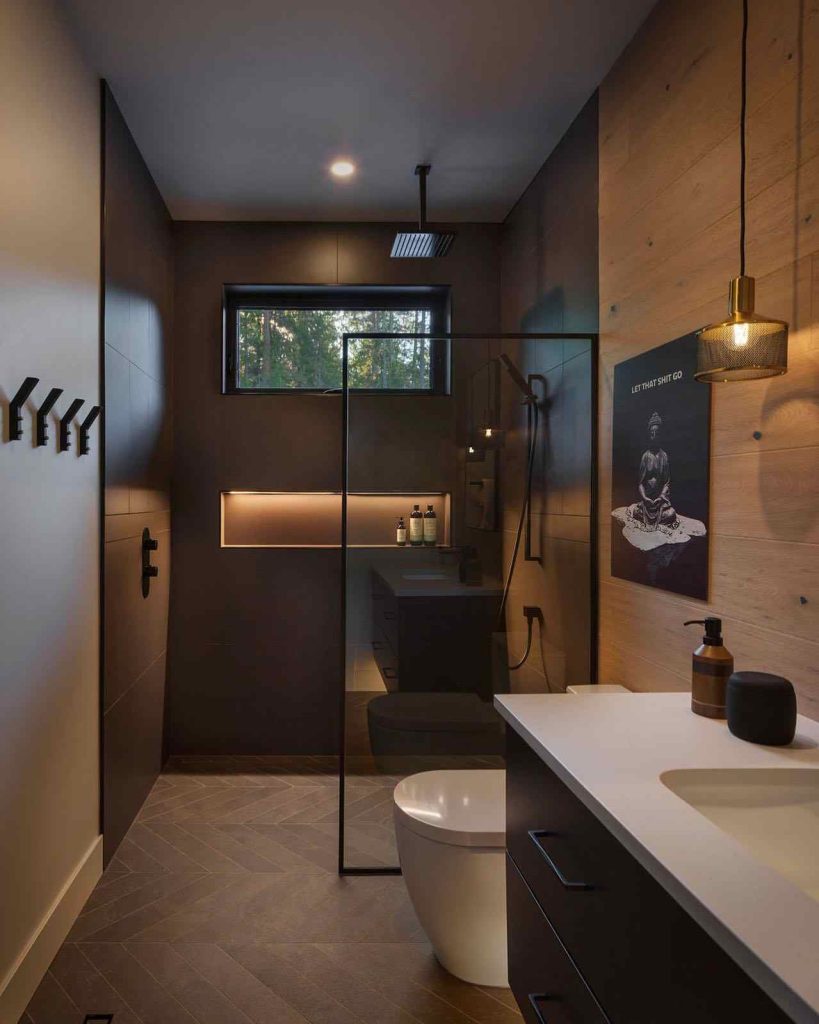 Zen-inspired bathroom with wood accents and dark modern fixtures