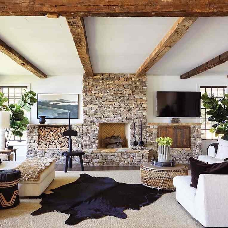 Stone fireplace with rustic wood beams