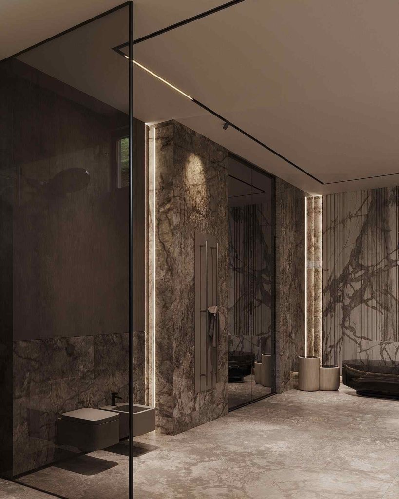 Marble-clad bathroom with dramatic textures and glass shower