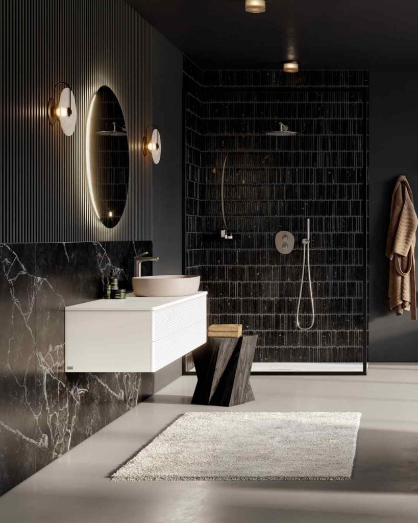 Minimalist bathroom with black tiles and floating white vanity