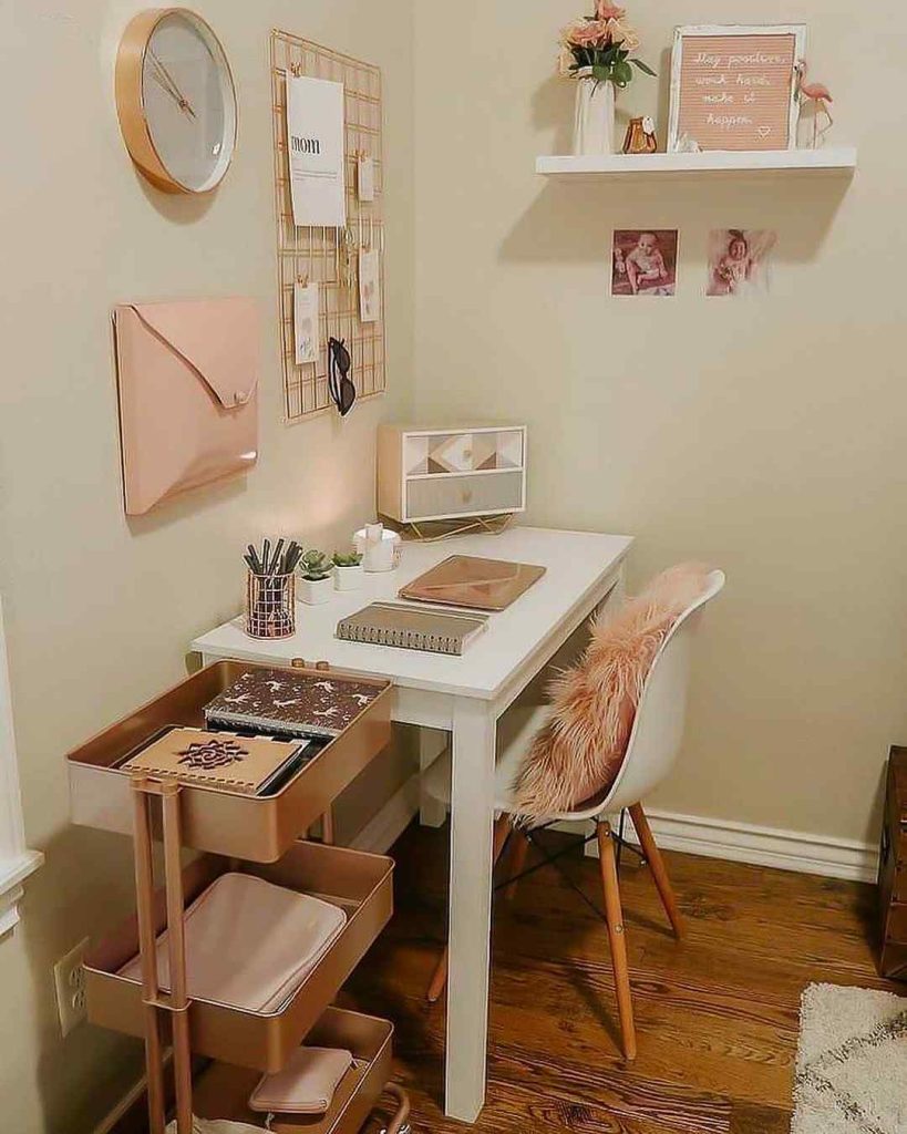 Blush-toned workspace with a rolling organizer.