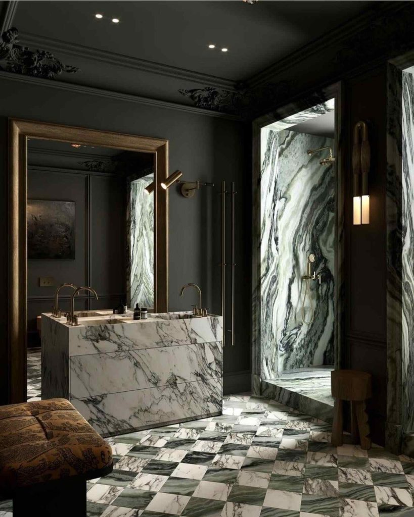 Luxurious bathroom with green marble and checkered flooring.