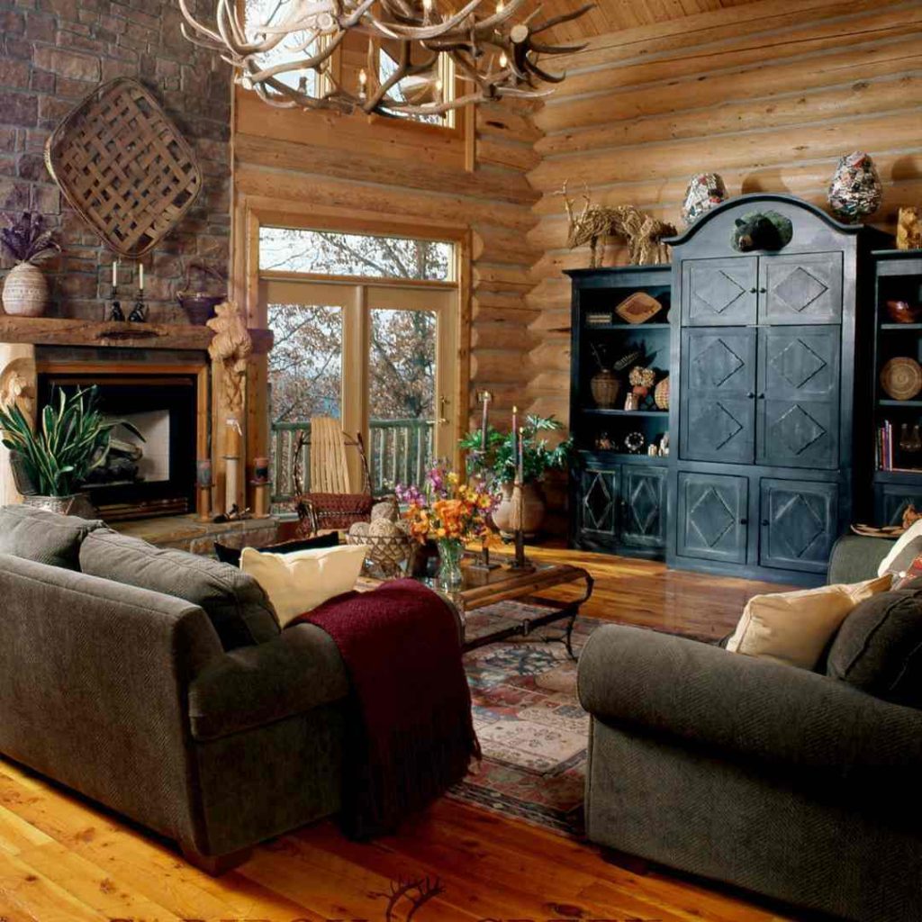 Cabin-style living room with antler chandelier