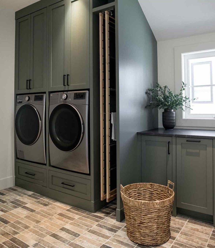 Classic laundry room with dark cabinets, woven baskets, and sunlight streaming in.
