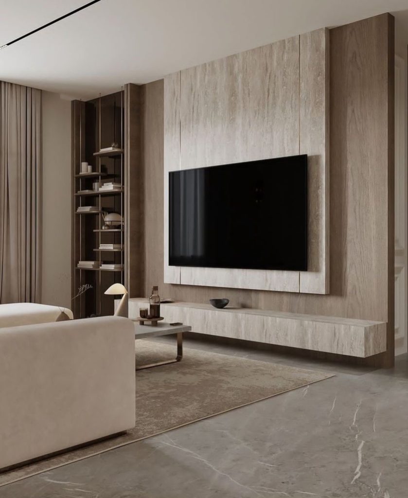 Minimalist TV wall with light wood tones and a sleek floating console.
