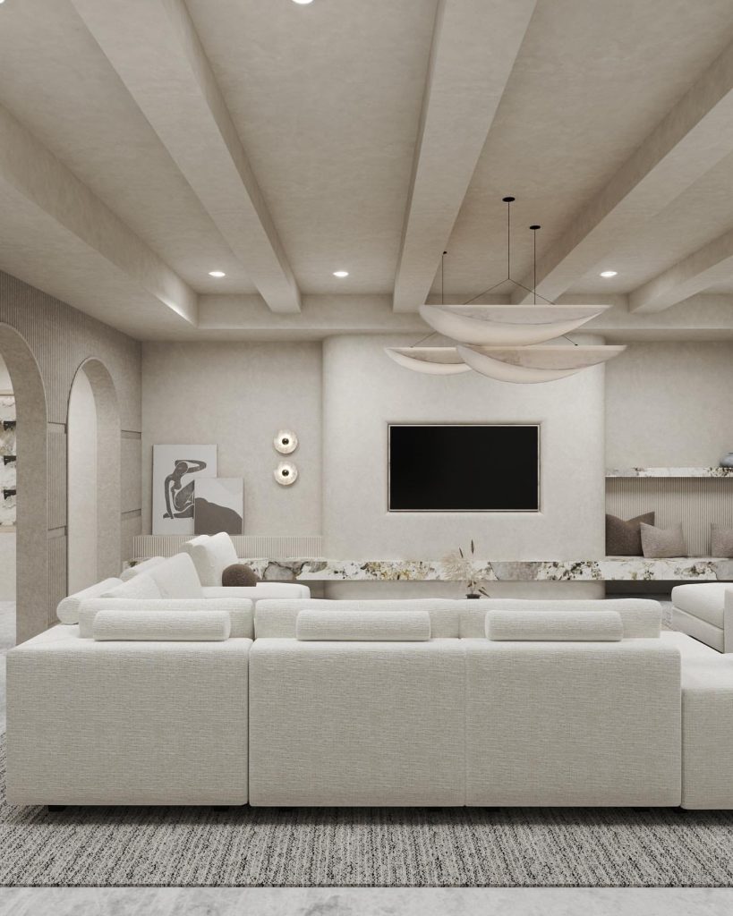 Neutral living space with artistic lighting and a contemporary TV wall.
