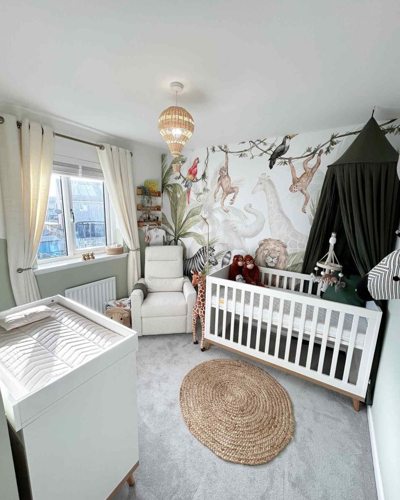 Jungle-themed nursery with animal mural and cozy decor 