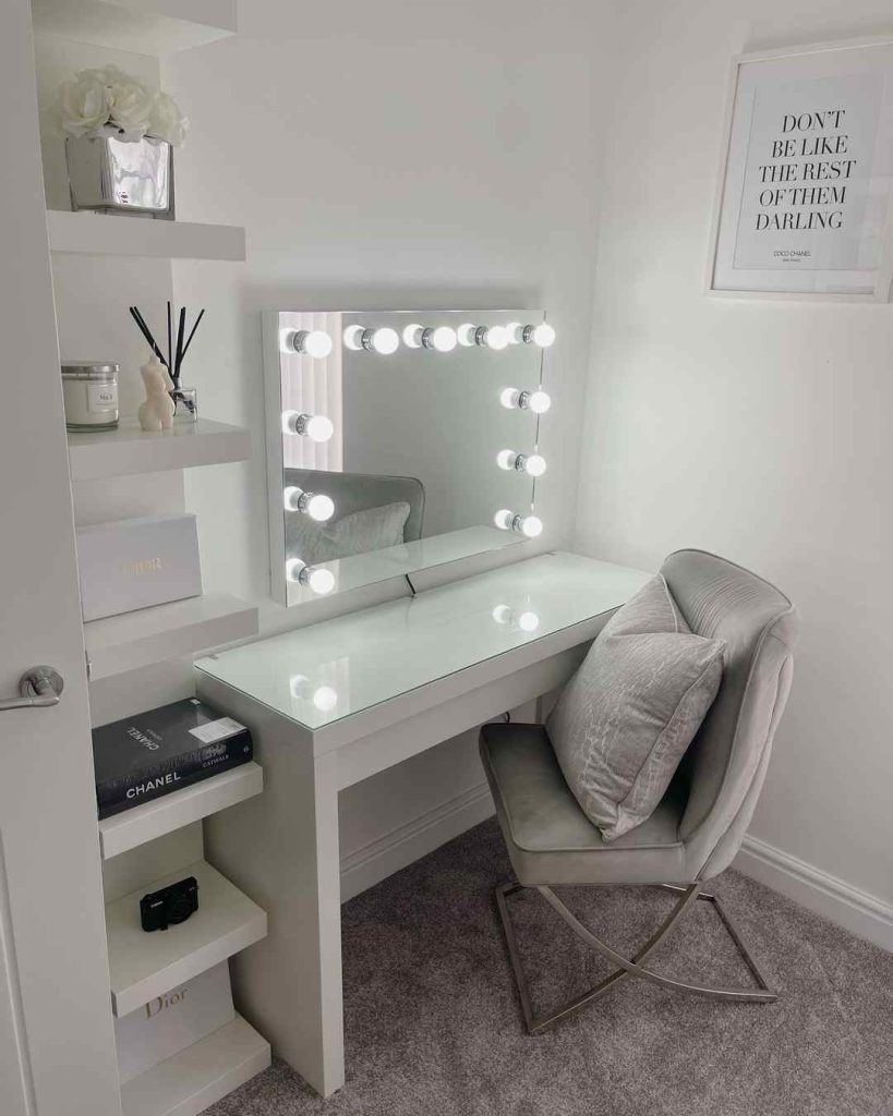 Compact vanity setup with a Hollywood-style lighted mirror.
