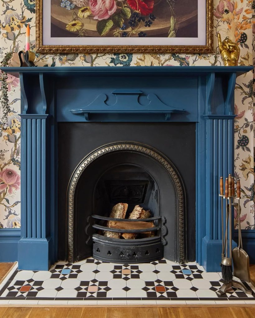 Contemporary fireplace with a wooden mantel and modern built-in shelves.
