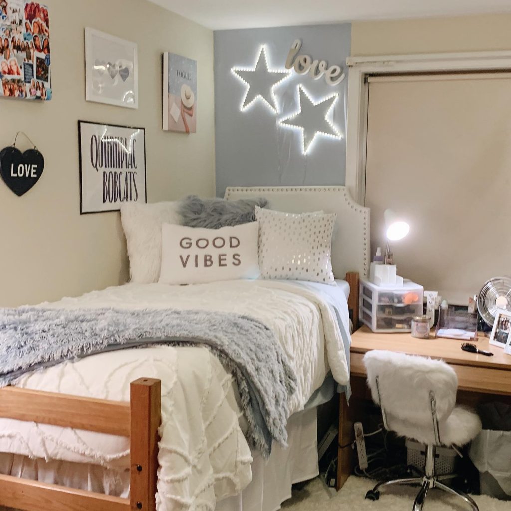 Comfortable dorm with light-up stars, fluffy textures, and neutral tones for a serene atmosphere.
