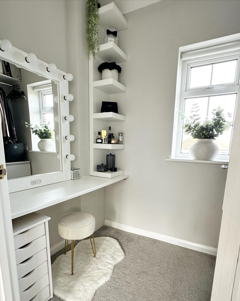 Compact vanity nook with floating shelves and faux fur accents.
