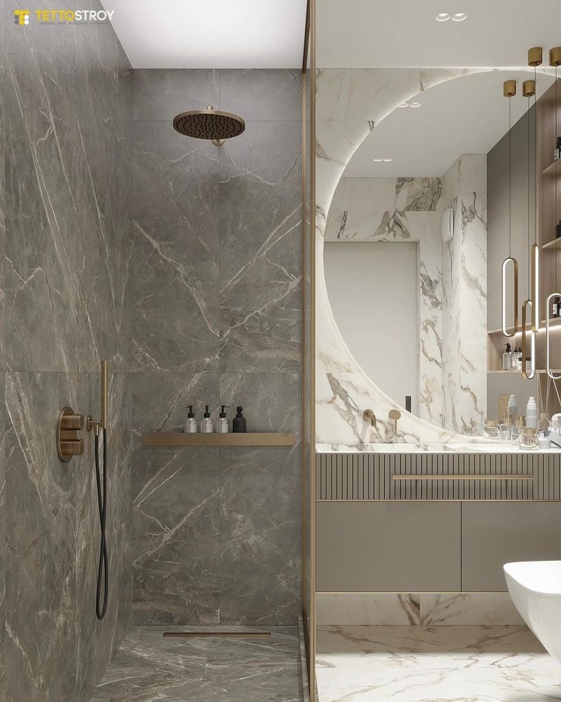 Contrasting marble tones in a modern shower and curved mirror vanity.