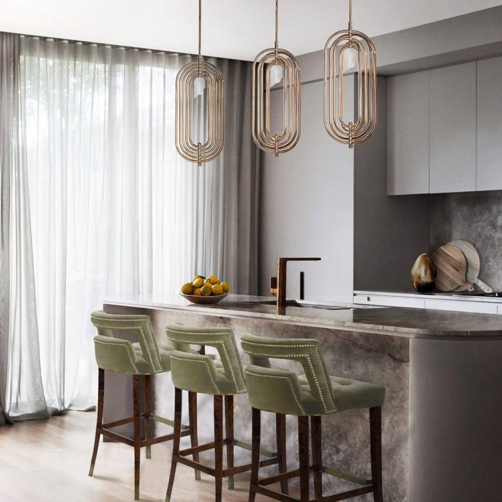 Elegant kitchen with marble island and statement pendant lights.
