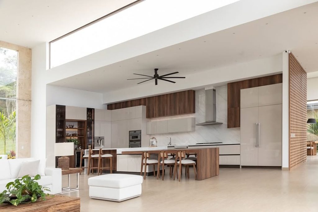 Spacious open kitchen with wood and white accents.
