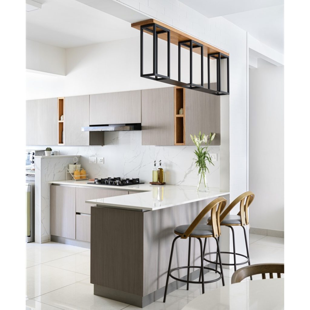 Modern kitchen with geometric overhead shelving.
