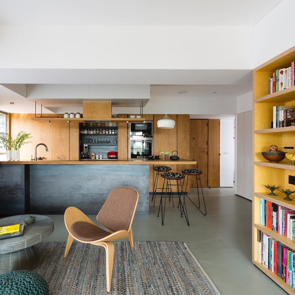 Cozy kitchen with wood cabinetry and industrial-style accents.
