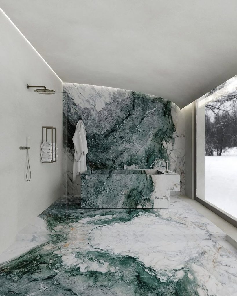 Luxurious green marble bathroom with large window and seamless design.