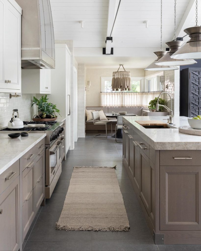 Rustic kitchen with muted tones and a cozy breakfast nook.
