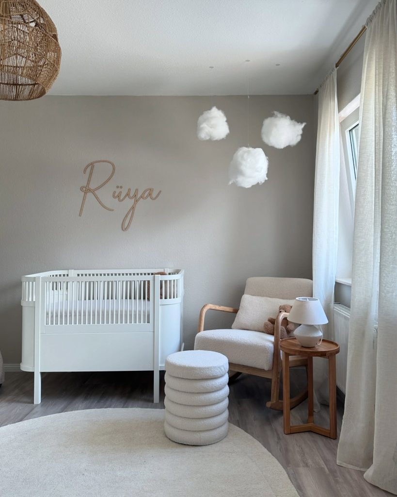 A serene modern baby room featuring natural textures and calming nursery decor ideas.