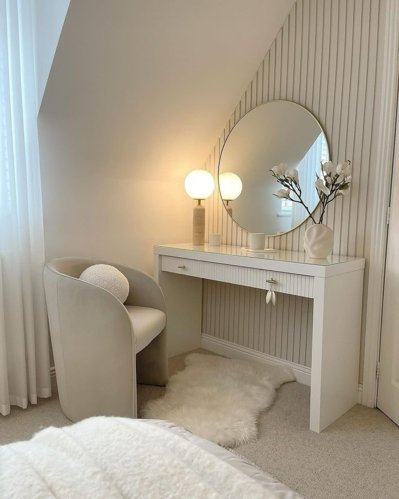 Minimalist vanity nook with slatted walls and soft globe lighting.
