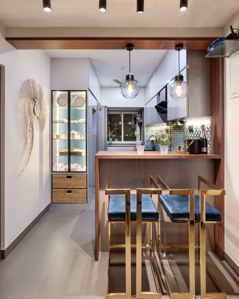 Compact kitchen with gold accents and sleek design.
