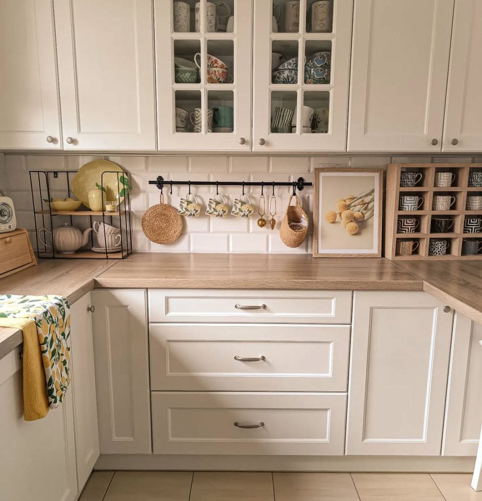 Minimalist boho kitchen with open shelving and cozy touches.
