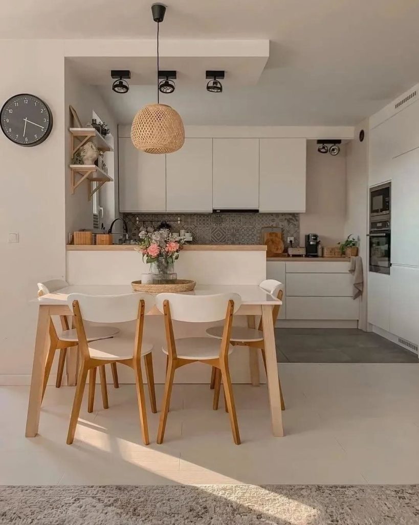 Modern boho cozy kitchen with woven pendant lights, sleek cabinets, and warm wood tones.
