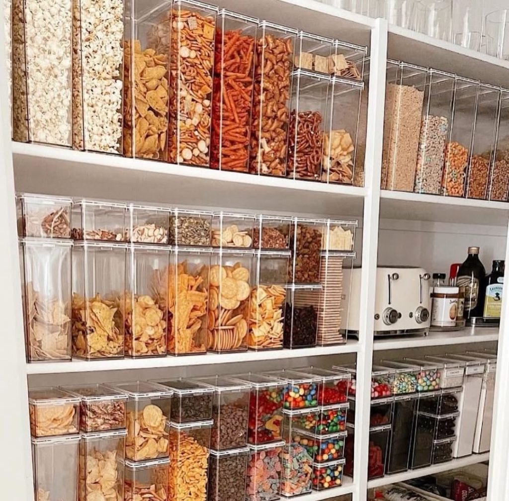 Neatly arranged snack pantry with cereal, pretzels, and dry goods.
