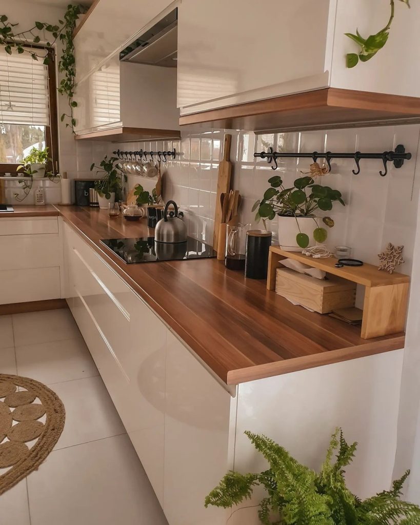 Warm and inviting small cozy kitchen with vintage lighting, candles, and rustic decor.
