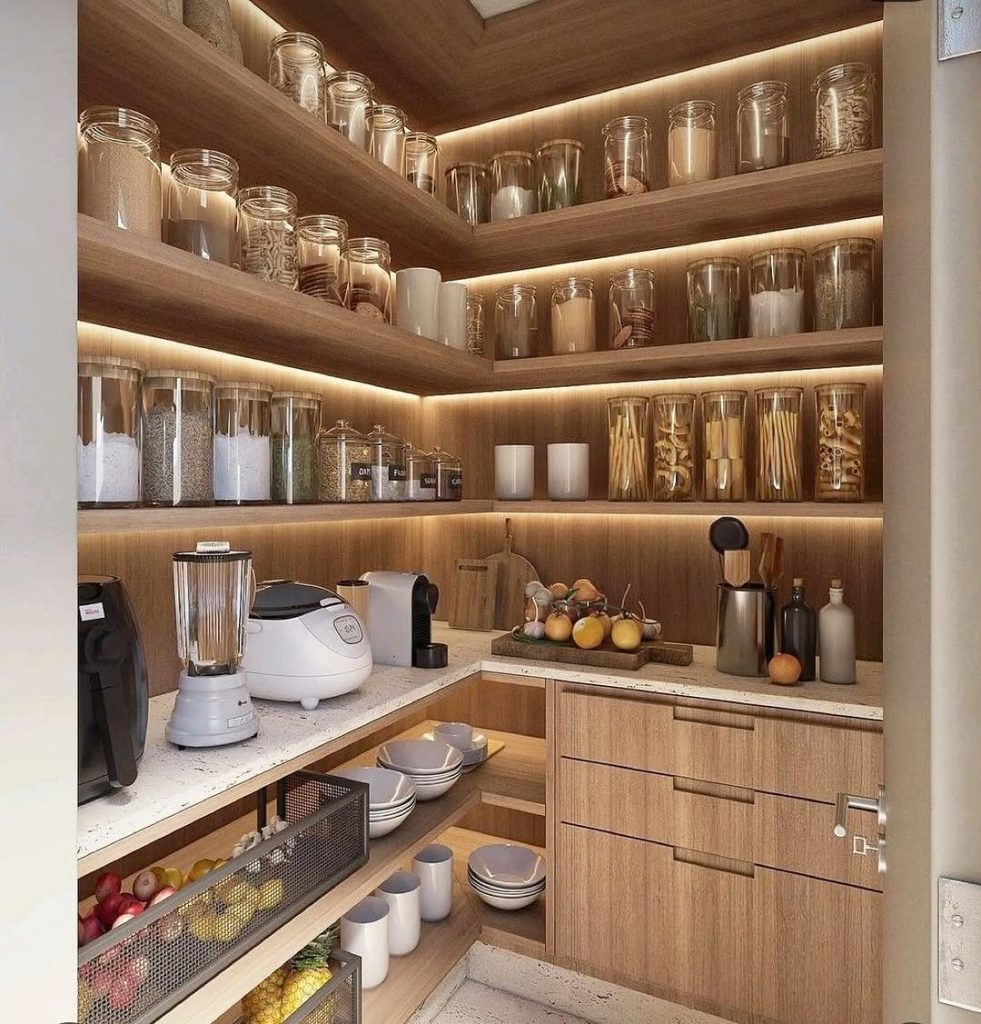 Modern pantry with warm wood shelving and soft LED lighting.
