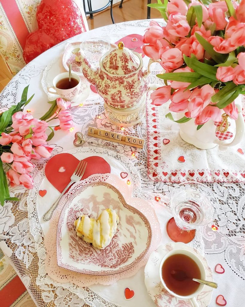 Charming tea-inspired romantic tablescape with lace and pink tulips.
