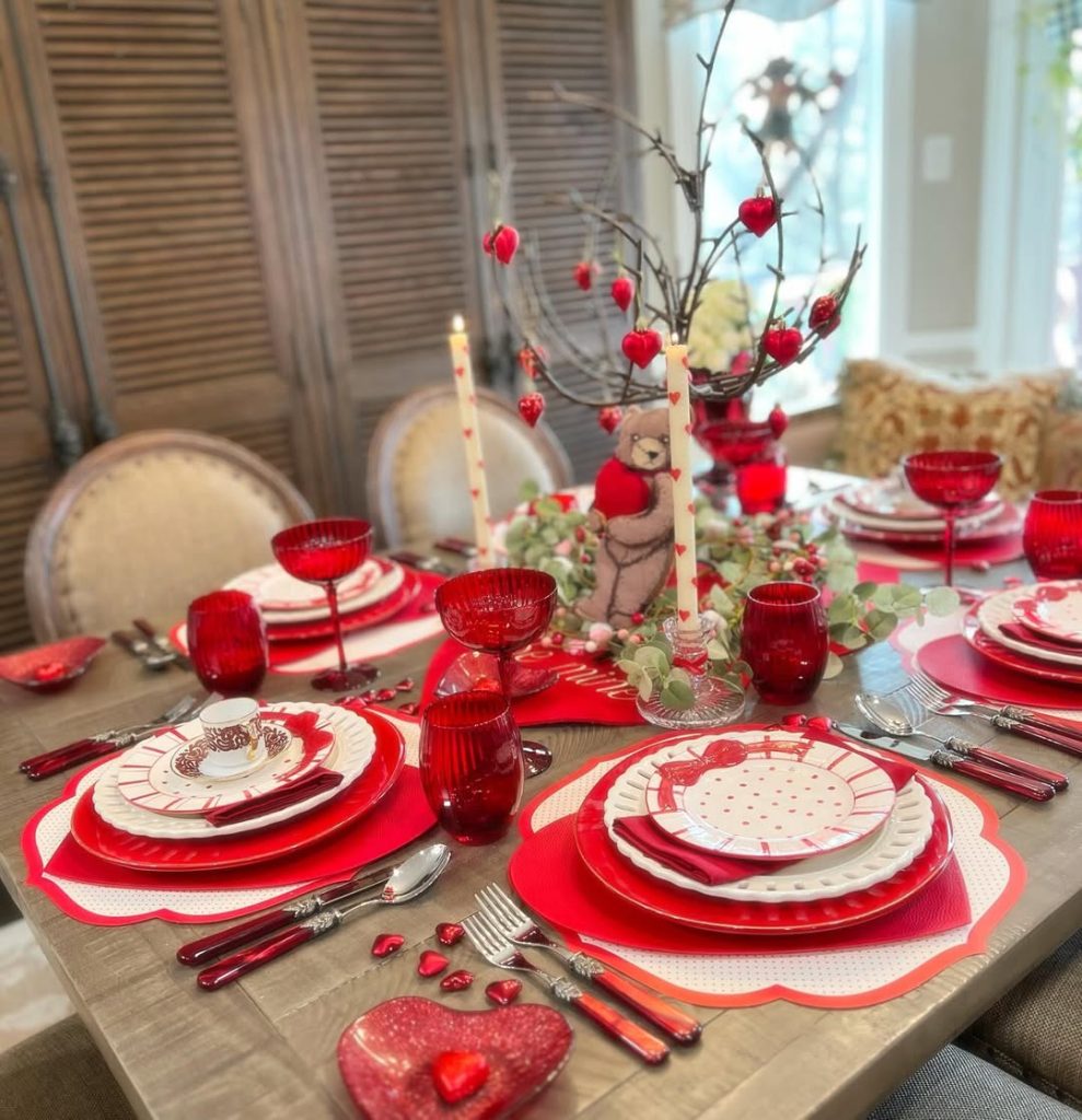 Festive romantic table with vibrant reds and playful heart-themed accents.
