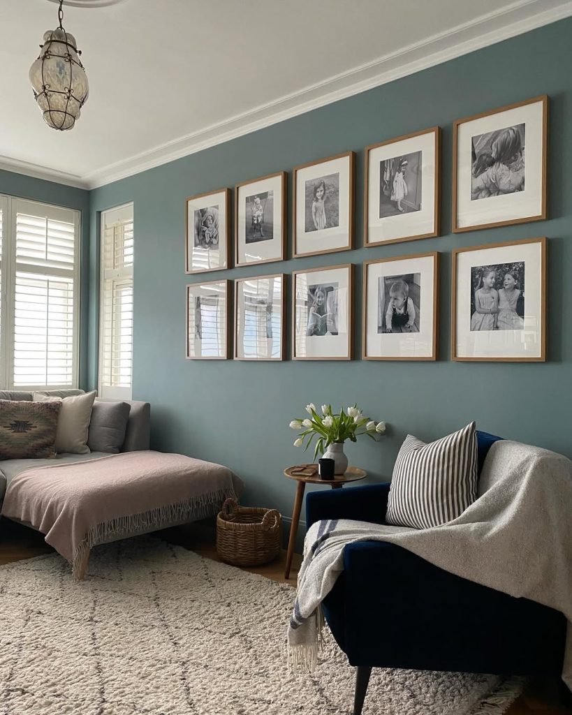 Light blue walls with cozy seating and decor for a timeless and serene living space.