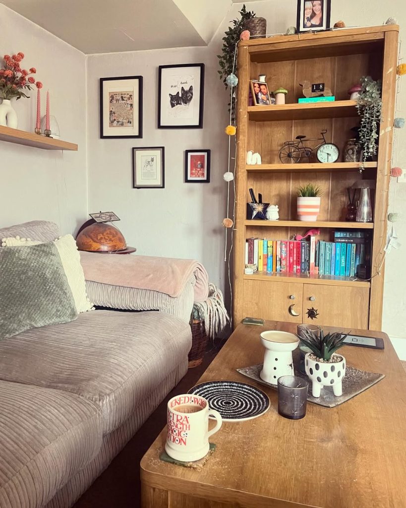 A cozy living room featuring a comfortable couch, a stylish coffee table, and a well-stocked bookshelf.