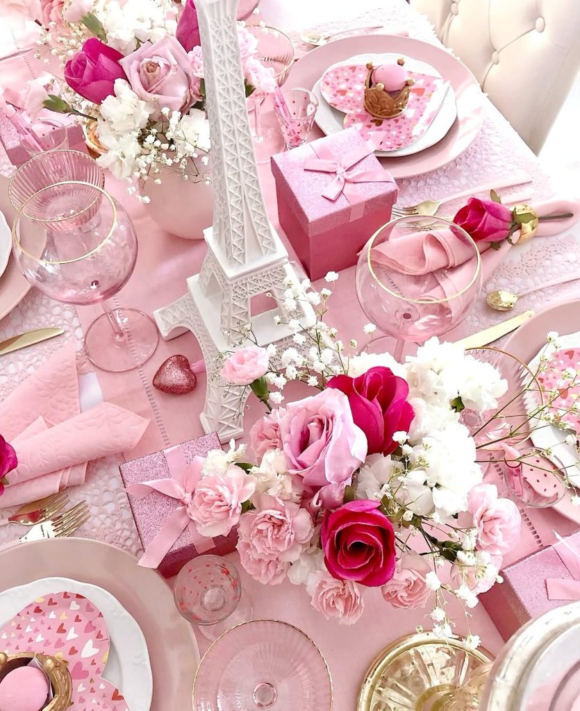 Paris-inspired romantic tablescape idea with pink tones and heart patterns.
