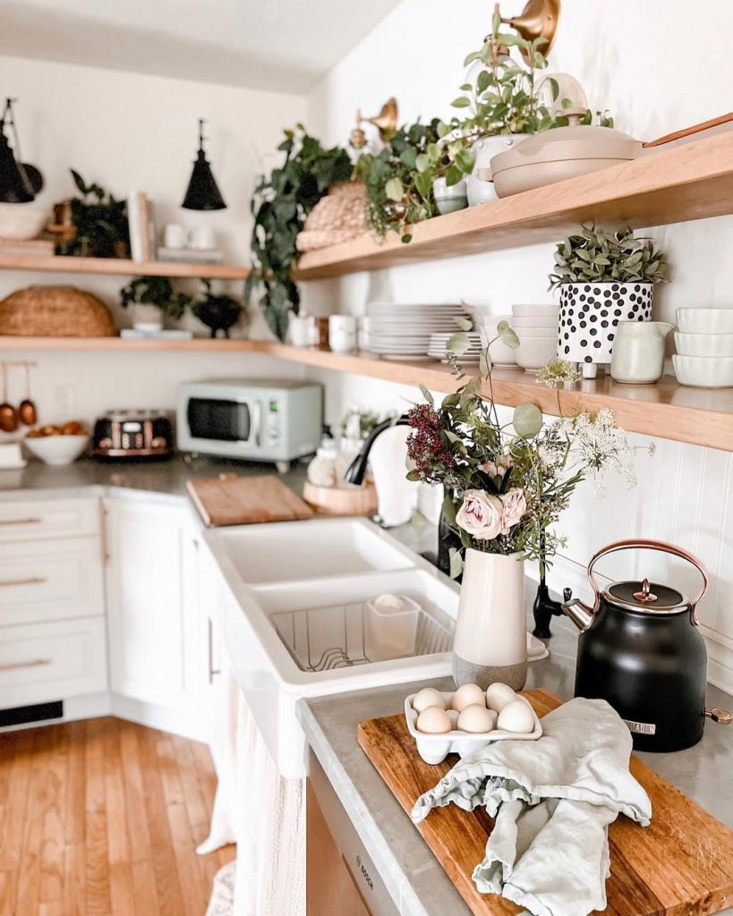 Earthy bohemian kitchen with warm wood tones and vintage touches.
