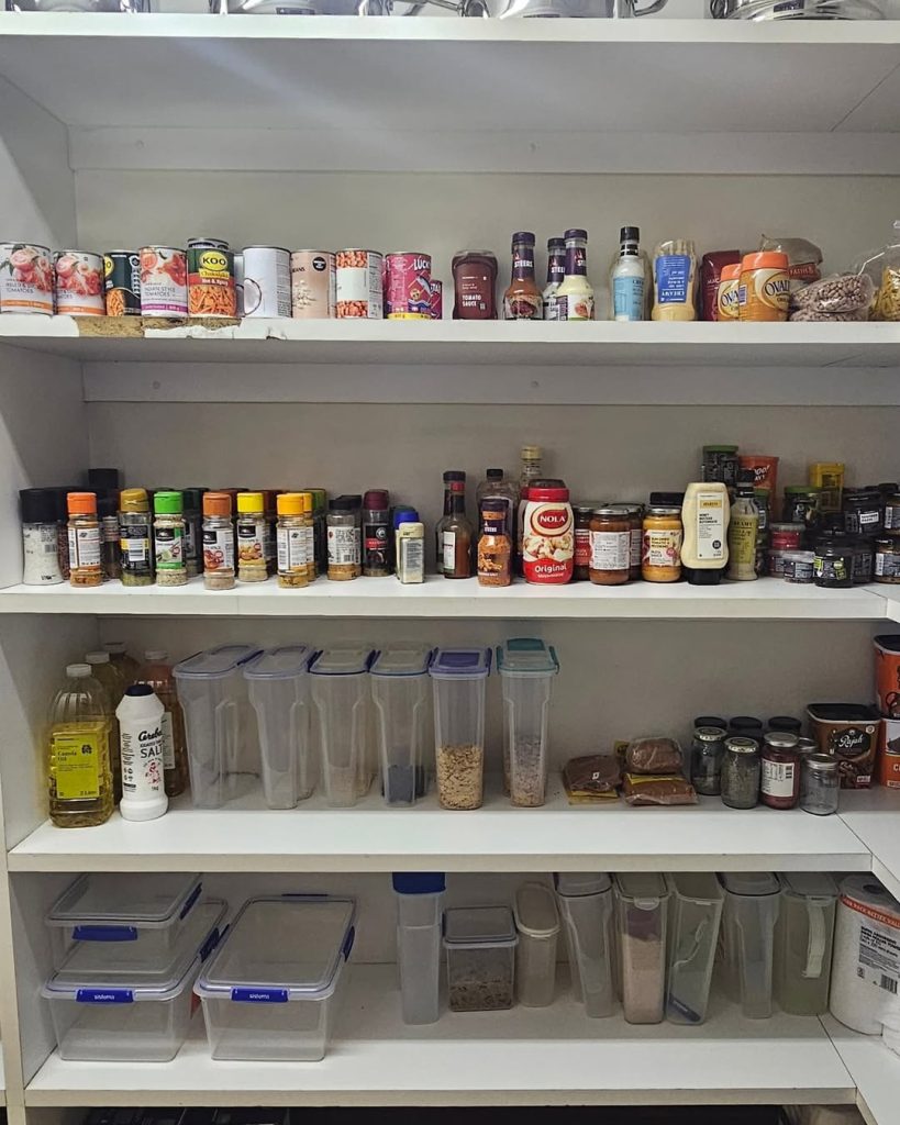 Simple pantry setup with labeled spice jars and airtight pantry storage containers.
