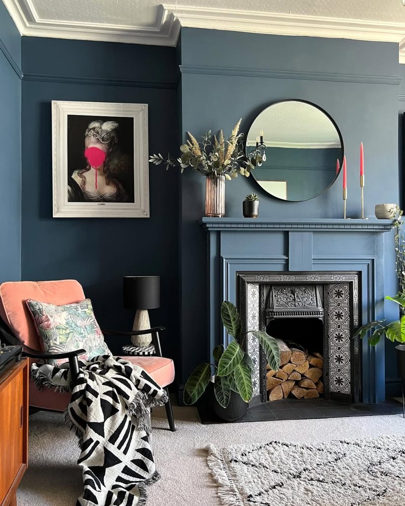 Elegant navy blue living room with a whimsical art piece and a detailed fireplace