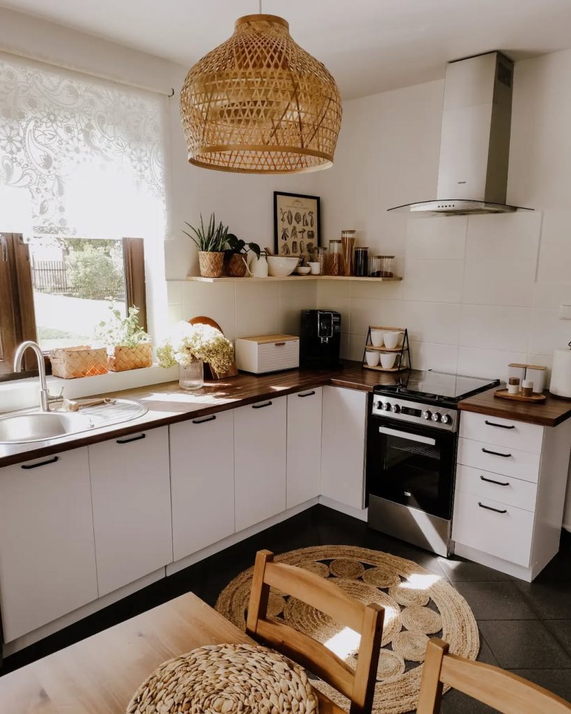 Warm and inviting boho kitchen with woven textures and plants.
