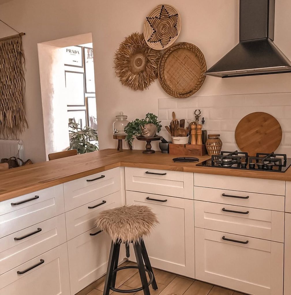 Bohemian kitchen with warm wood countertops and woven decor.
