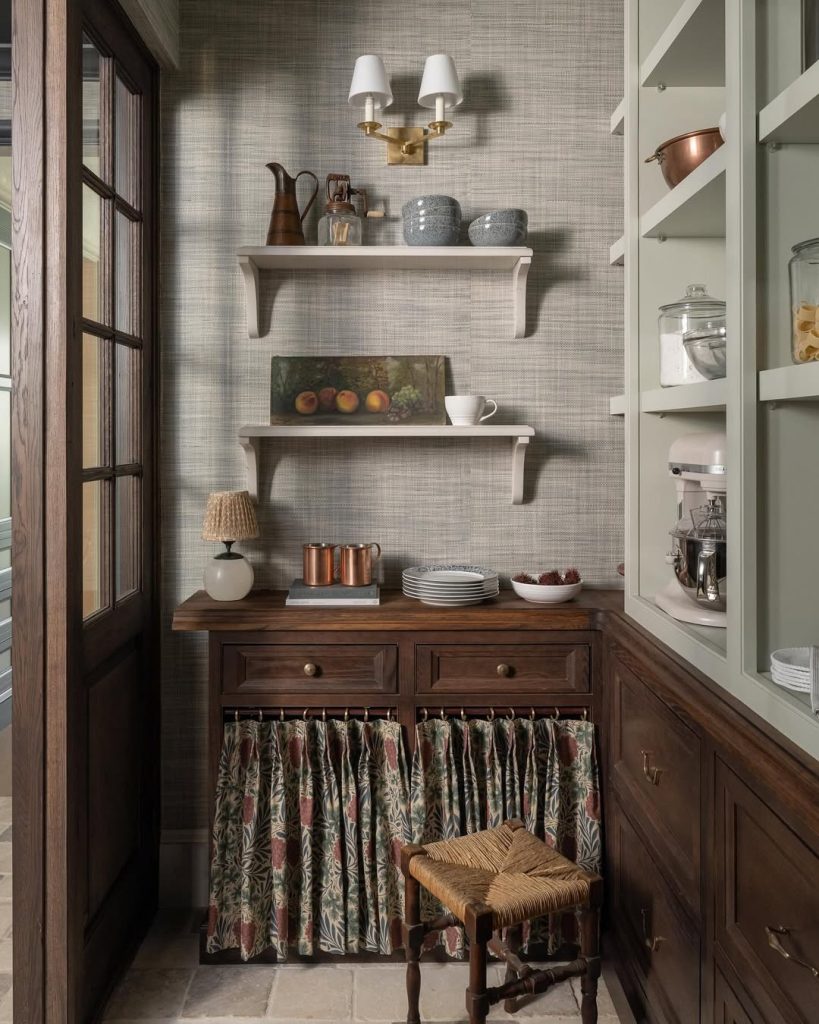 Vintage-style kitchen pantry with wooden cabinets and rustic open shelving.
