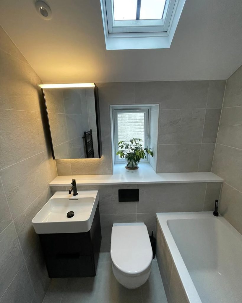 Classic white and wood small bathroom with black fixtures.
