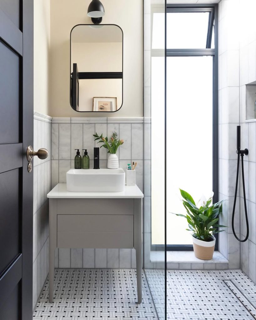 Bold blue and geometric tile modern small bathroom design.
