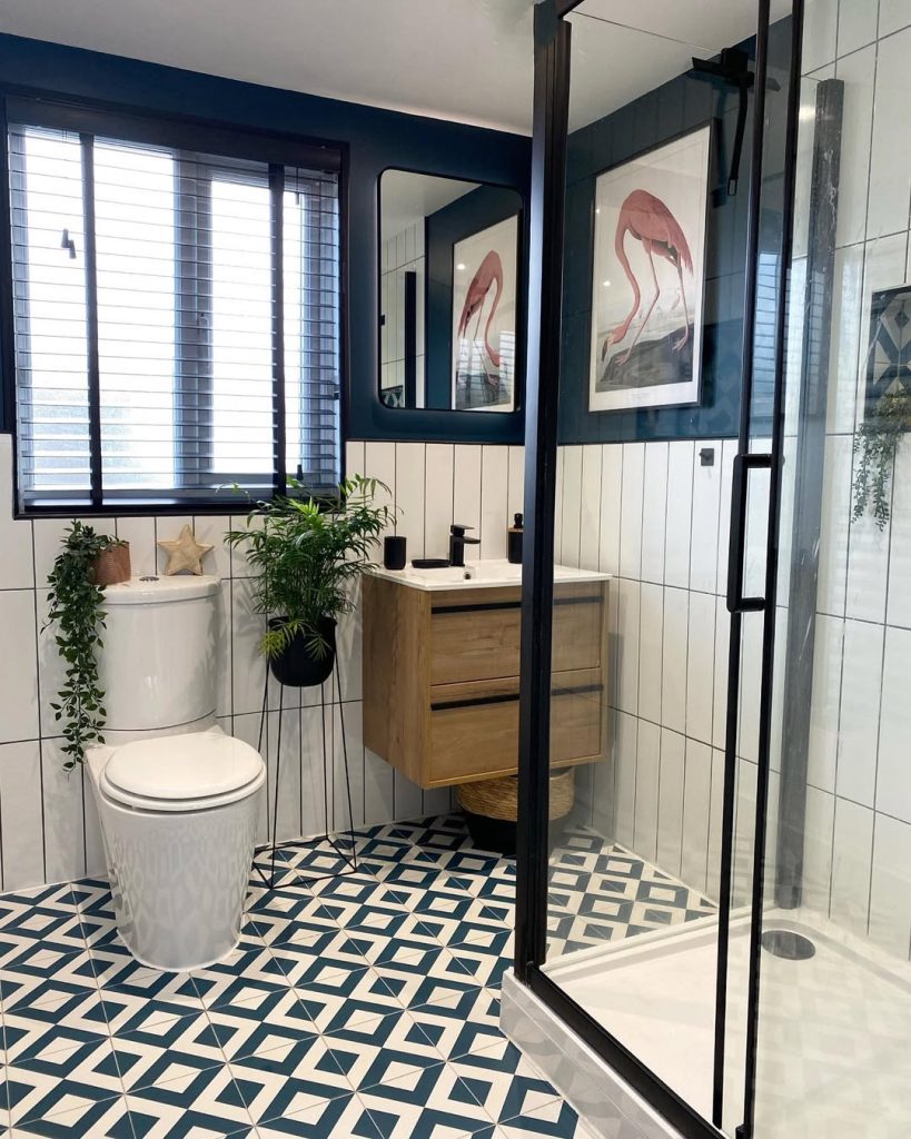 Soft pastel and hexagonal tile small bathroom with gold fixtures.
